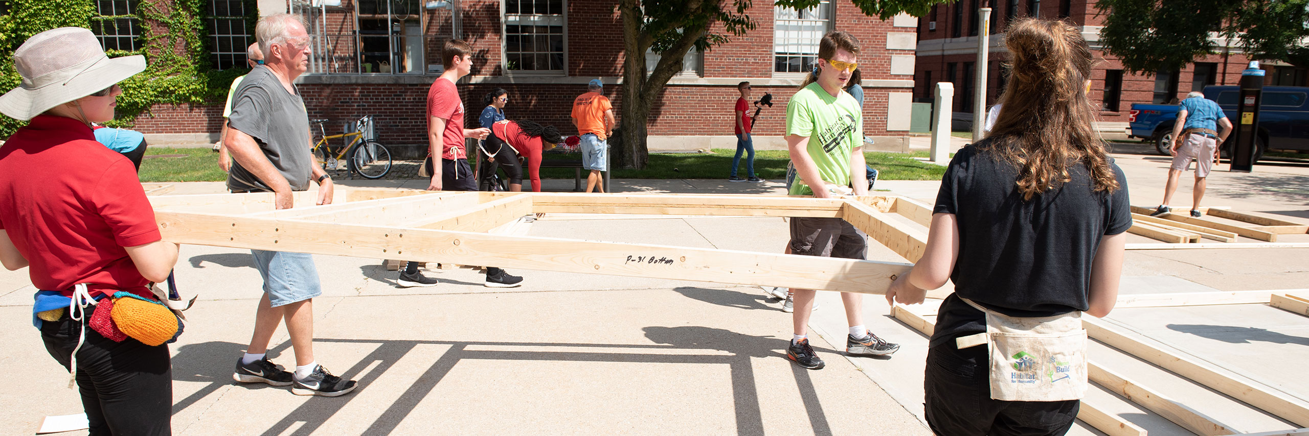 Students and faculty working on habitat for humanity house