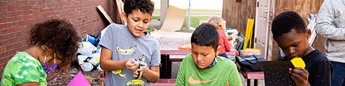 kids participating in the Unity Community Center after-school program doing some painting and other hands-on art activities. 