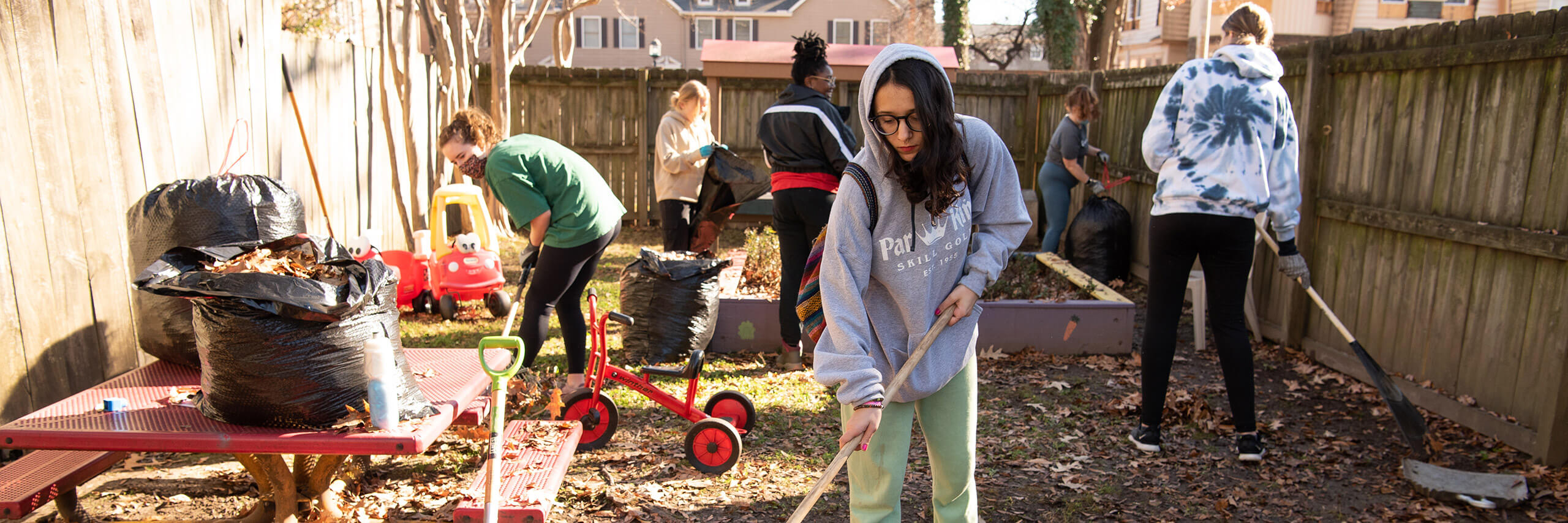 A group of student volunteers are taking part in community service.