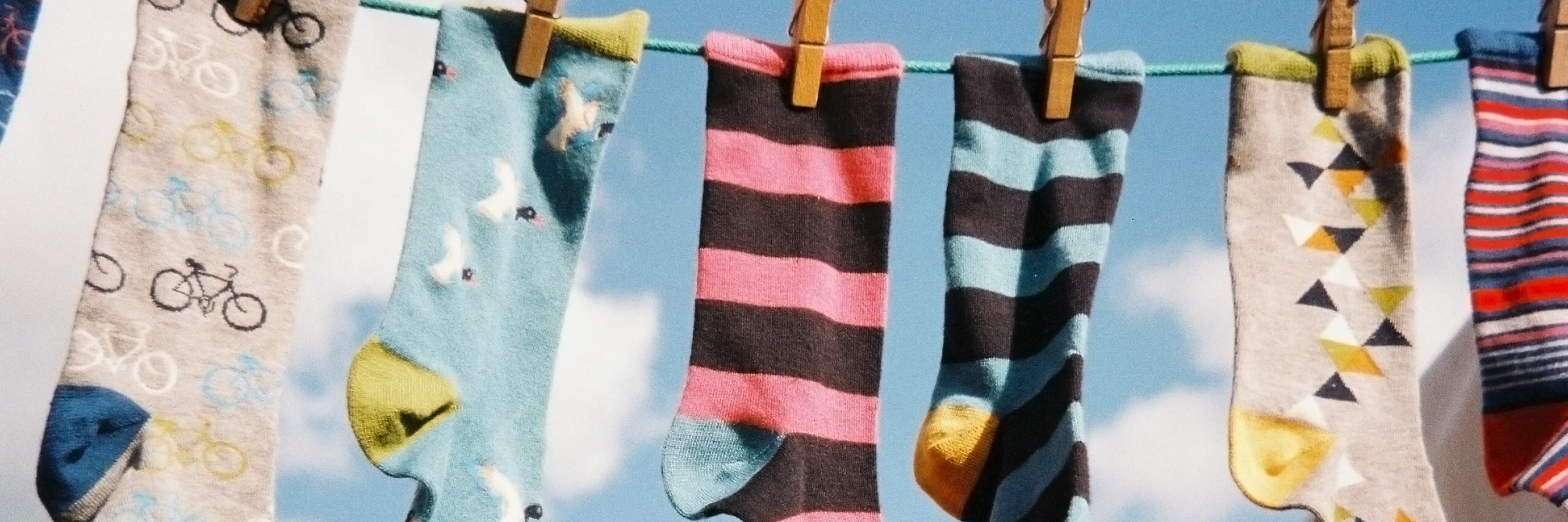 Image of socks hung in a wire.