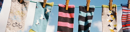 Image of socks hung in a wire.