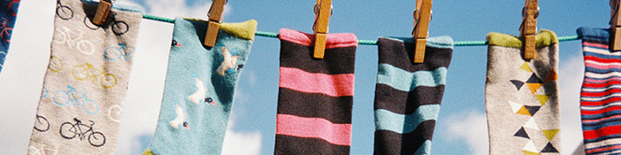 Image of socks hung in a wire.